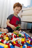 Young boy playing with building blocks
