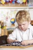 Young Boy Playing at Montessori/Pre-School royalty free stock image Young Boy Playing at Montessori/Pre-School royalty free stock image