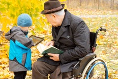 Young Boy Showing His Grandfather His Tablet Stock Photos