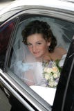 Young bride in a veil and with a bouquet