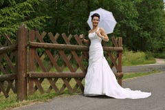 Young Bride With Sunshade Stock Photography
