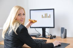 Young business person eating in work royalty free stock photos Young business person eating in work royalty free stock photos