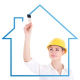 Young business woman architect drawing house with paint brush is Royalty Free Stock Photo Young business woman architect drawing house with paint brush is Royalty Free Stock Photo