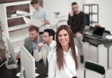 Young business woman on the background of the business team. stock images Young business woman on the background of the business team. stock images