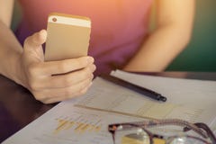 young business woman working from home using smart phone with pa stock photography young business woman working from home using smart phone with pa stock photography