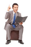 Young businessman reading a book and got the idea Stock Photography Young businessman reading a book and got the idea Stock Photography