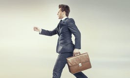 Young businessman running into his career stock image Young businessman running into his career stock image