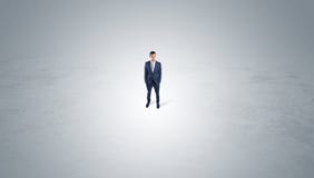Businessman standing in the middle of an empty space royalty free illustration Businessman standing in the middle of an empty space royalty free illustration
