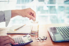Young businessman using calculator for finance, tax and saving money. Royalty Free Stock Photo Young businessman using calculator for finance, tax and saving money. Royalty Free Stock Photo