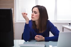 Businesswoman Looking At Her Fingernail stock photos Businesswoman Looking At Her Fingernail stock photos