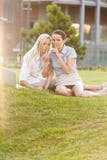 Young businesswomen gesturing silence in office lawn Stock Photo Young businesswomen gesturing silence in office lawn Stock Photo