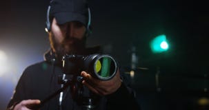 Young cameraman shooting a scene royalty free stock image Young cameraman shooting a scene royalty free stock image