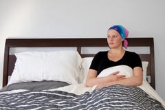 Portrait of a young cancer patient resting in bed looking out window stock photos Portrait of a young cancer patient resting in bed looking out window stock photos