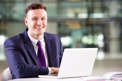 Young Caucasian businessman using laptop computer at work stock photos Young Caucasian businessman using laptop computer at work stock photos