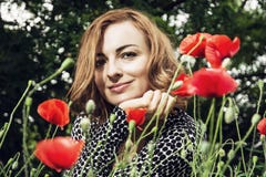 Young caucasian smiling woman with corn poppy flowers, beauty an royalty free stock photo Young caucasian smiling woman with corn poppy flowers, beauty an royalty free stock photo