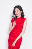 Young celebrating asian woman in red dress holding wine glass. stock image Young celebrating asian woman in red dress holding wine glass. stock image