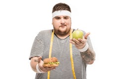 Young chubby man looking at casolated on white Stock Photography Young chubby man looking at casolated on white Stock Photography