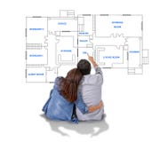 Young couple dreaming and imaging their new house in real state concept