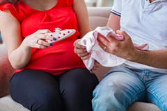 The young couple family expecting a baby royalty free stock images The young couple family expecting a baby royalty free stock images