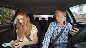Young couple going in the car and counting the money. 4K. stock video Young couple going in the car and counting the money. 4K. stock video