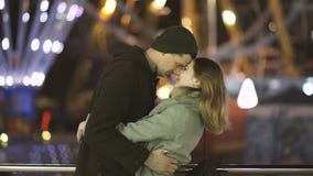 Young Couple Having Fun On An Amusement Park Date At Night Stock Image Young Couple Having Fun On An Amusement Park Date At Night Stock Image