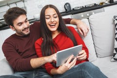 https://thumbs.dreamstime.com/t/young-couple-having-romantic-evening-home-watching-movies-digital-tablet-young-men-women-having-romantic-evening-indoors-108115610.jpg