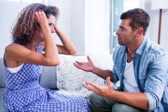 Young couple sitting together and discussing after a fight royalty free stock photography Young couple sitting together and discussing after a fight royalty free stock photography