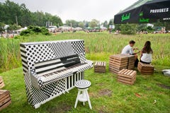 Young couple talking outdoor near the old piano at the youth party stock photos Young couple talking outdoor near the old piano at the youth party stock photos