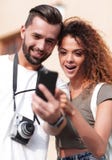 Young couple visiting city in summertime and looking photos royalty free stock photography Young couple visiting city in summertime and looking photos royalty free stock photography