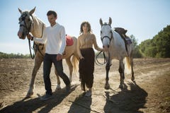 Young couple walking in a picturesque place with stock image Young couple walking in a picturesque place with stock image