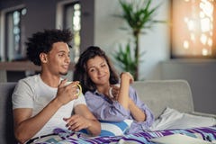 https://thumbs.dreamstime.com/t/young-couple-watching-movie-their-laptop-bed-young-couple-watching-movie-their-laptop-bed-133355395.jpg