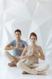 Young couple in yoga pose Stock Image Young couple in yoga pose Stock Image