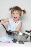 Young cute girl cooking