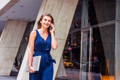 Young Eastern European American Woman talking on phone, traveling, working in New York royalty free stock photo Young Eastern European American Woman talking on phone, traveling, working in New York royalty free stock photo