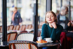 Young elegant woman drinking coffee in cafe in Paris, France Stock Photo Young elegant woman drinking coffee in cafe in Paris, France Stock Photo