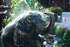 Young Elephant Splashing Water. Royalty Free Stock Image