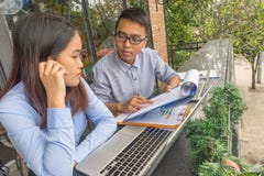 Young employees discuss about business report royalty free stock photos Young employees discuss about business report royalty free stock photos
