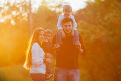 Young family with children walking in park. royalty free stock photo Young family with children walking in park. royalty free stock photo
