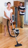 Young family couple doing regular clean-up royalty free stock photos Young family couple doing regular clean-up royalty free stock photos