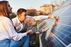 Young Family Getting To Know Alternative Energy Stock Image