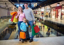 Young family with shopping bags stock photo Young family with shopping bags stock photo