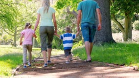 Young family walking stock footage Young family walking stock footage