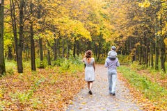 Young family walking in the park an autumn day royalty free stock photography Young family walking in the park an autumn day royalty free stock photography