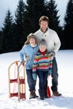 Young Father And Children In Snow With Sled stock image Young Father And Children In Snow With Sled stock image