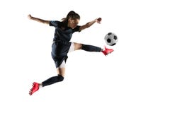Female soccer player kicking ball isolated over white background royalty free stock photos Female soccer player kicking ball isolated over white background royalty free stock photos