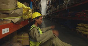 Young female male worker in a warehouse stock video Young female male worker in a warehouse stock video