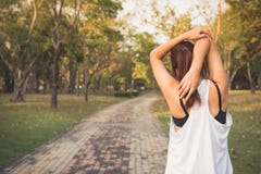 Young female stretching before fitness training session at the park. Healthy young woman warming up outdoors. stock photos Young female stretching before fitness training session at the park. Healthy young woman warming up outdoors. stock photos