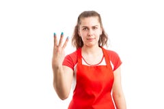 Female supermarket or hypermarket worker showing number three royalty free stock photos Female supermarket or hypermarket worker showing number three royalty free stock photos