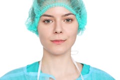 Young female surgeon doctor standing with arms crossed and smiling, Isolated over white background stock photos Young female surgeon doctor standing with arms crossed and smiling, Isolated over white background stock photos