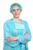Young female surgeon doctor standing with arms crossed and smiling, Isolated over white background royalty free stock images Young female surgeon doctor standing with arms crossed and smiling, Isolated over white background royalty free stock images
